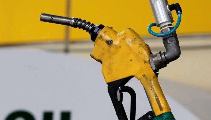 A gas pump is seen hanging at a fuel station. — Reuters/ File