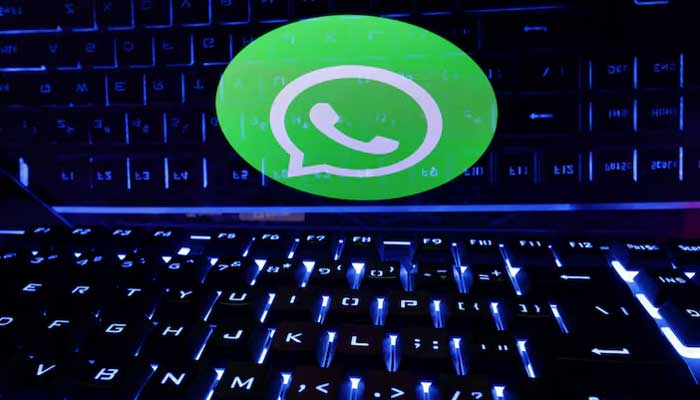 A keyboard is placed in front of a displayed WhatsApp logo in this illustration taken February 21, 2023. — Reuters