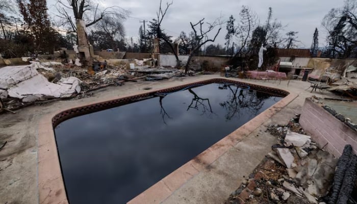 A burned home and contaminated pool await the arrival of specialists from the Environmental Protection Agency (EPA) to remove toxic and hazardous debris following the Eaton Fire in Altadena, California, US, on January 30, 2025. — Reuters