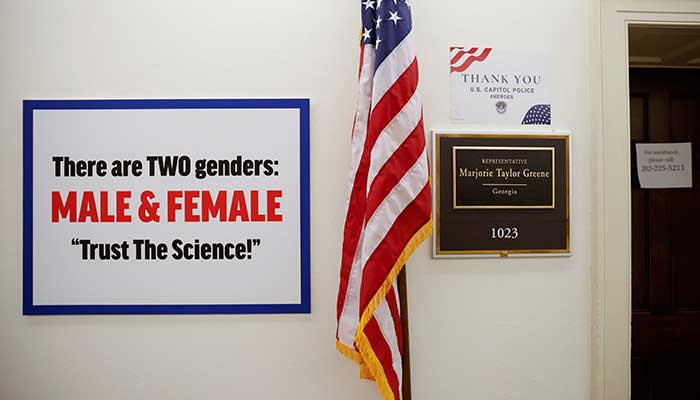 A sign hangs on the wall outside the office of Marjorie Taylor Greene in Washington, US, February 25, 2021. — Reuters