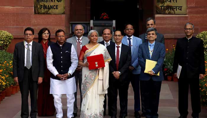 Indias Finance Minister Nirmala Sitharaman holds a folder with the Government of Indias logo as she poses with her officials while leaving her office to present the annual budget in the parliament, in New Delhi, India, February 1, 2025. — Reuters