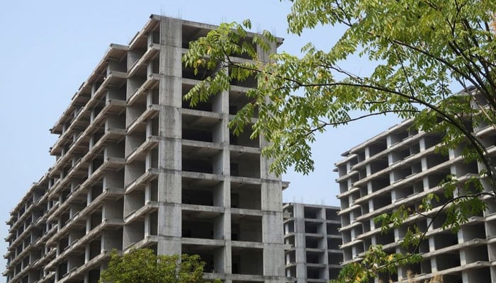 Unfinished apartment buildings stand at a residential complex developed by Jiadengbao Real Estate in Guilin, Guangxi Zhuang Autonomous Region, China September 17, 2022. — Reuters