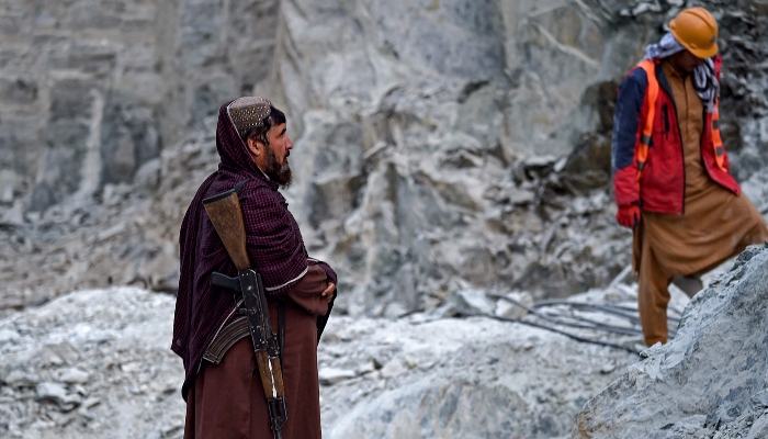 This photograph taken on January 18, 2025 shows a Taliban security personnel standing guard at a Nephrite mine in the mountains of Goshta district, Nangarhar province, Afghanistan. — AFP