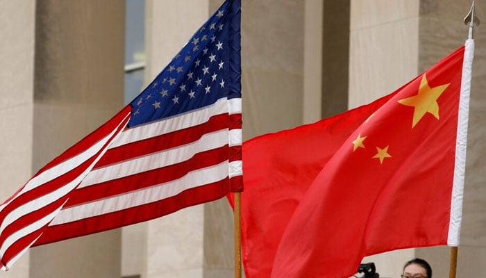 US and Chinese flags are seen before a meeting between senior defence officials from both countries at the Pentagon in Arlington, Virginia, US on November 9, 2018. — Reuters