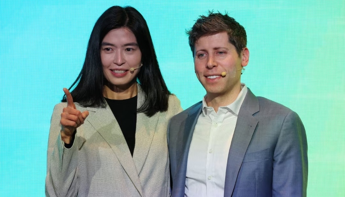 OpenAI CEO Sam Altman and Kakao CEO Chung Shin-a pose for photographs after a press conference to announce partnerships on AI services, in Seoul, South Korea, February 4, 2025. — Reuters