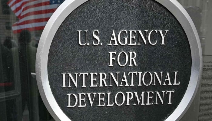 Signage is seen near the entrance to the headquarters of the USAID, in Washington, DC, on February 3, 2025. — AFP