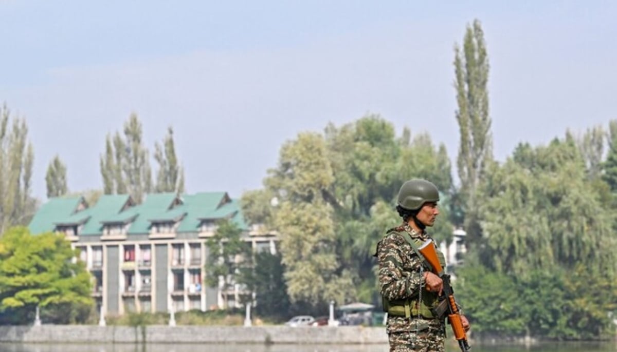 An Indian paramilitary trooper stands guard near a counting centre in Srinagar on October 8, 2024, as counting of votes is underway for the local assembly elections. — AFP