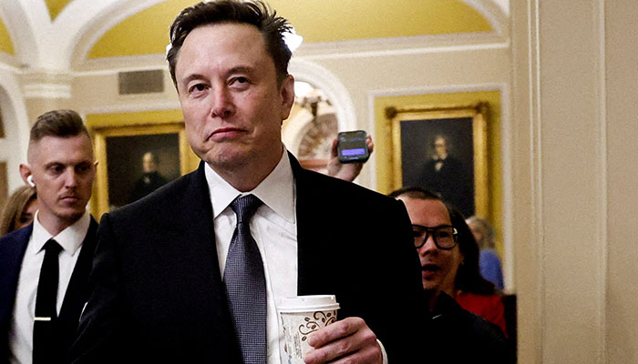 Elon Musk walks on Capitol Hill on the day of a meeting with Senate Republican Leader-elect John Thune (R-SD), in Washington, U.S. December 5, 2024. — Reuters