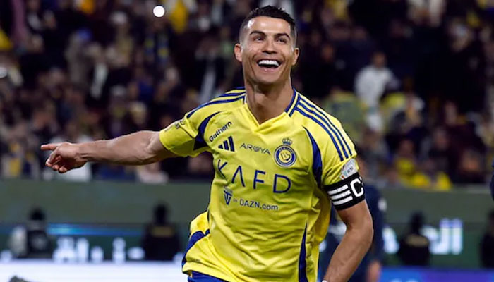 Al Nassrs Portguese striker Cristiano Ronaldo laughs during a game in this undated image. — Reuters/File