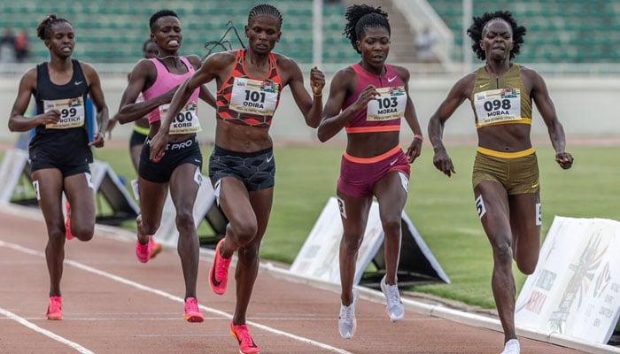 Kenyan runners Mary Moraa, right, Sarah Moraa, second from right, and Lilian Odira, center, fight for the lead in the womens 800-meter final during the Kenya Athletics Olympic Trials at Nyayo National Stadium in Nairobi, June 14, 2024. — AFP