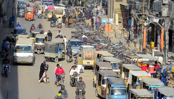 View of illegal encroachment on a road, which is creating problems for passersby and commuters alike, at Karimabad area in Karachi on February 4, 2025. — PPI