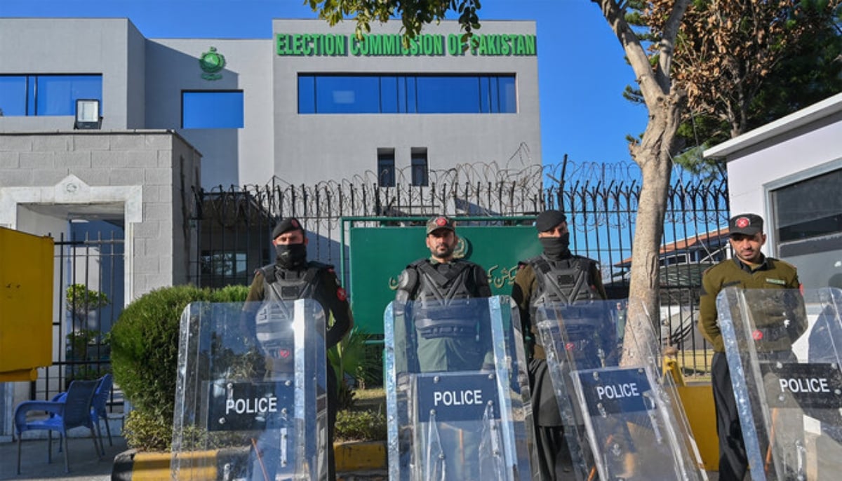 Pakistan Frontier Constabulary (FC) personnel stand guard in front the Election Commission office in Islamabad on February 9, 2024. — AFP