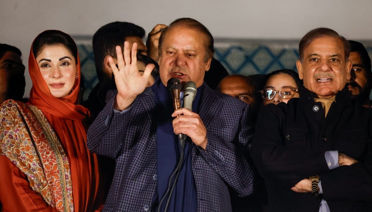 Former premier Nawaz Sharif (centre) speaks, flanked by now Prime Minister Shahbaz Sharif and Punjab CM Maryam Nawaz, at the party office of PML-N at Model Town in Lahore on February 9, 2024. — Reuters