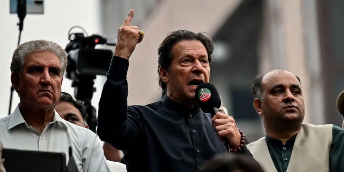 PTI leaders Shah Mahmood Qureshi (L) and Imran Khan. — AFP/File