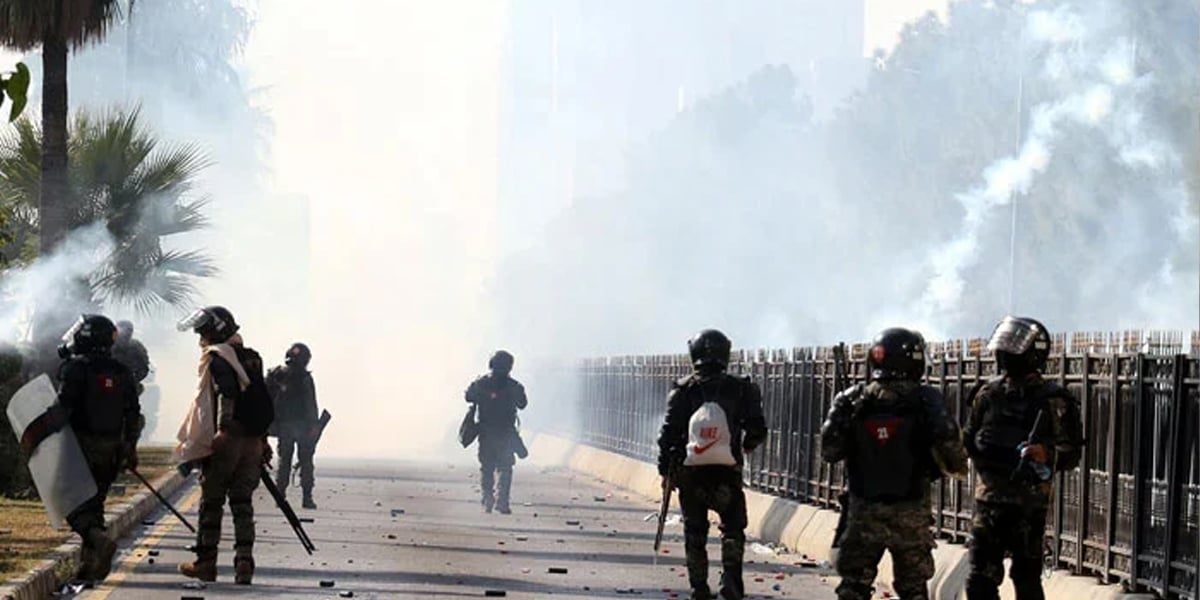 A view of the security personnel firing tear gas shell amidst clash with PTI protesters in Islamabad on November 26, 2024. — INP