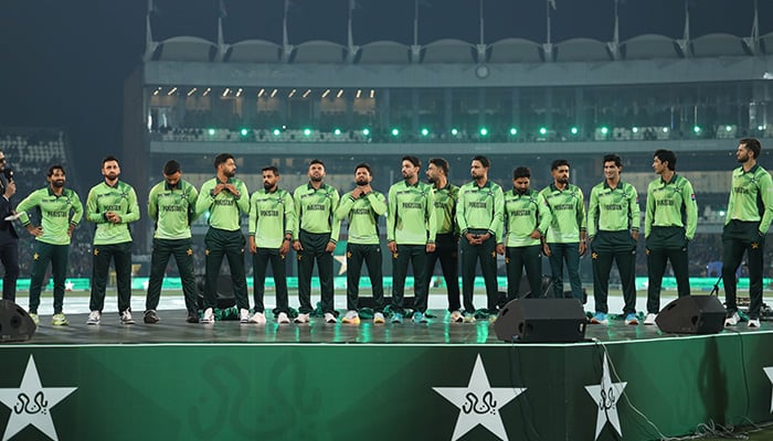 Pakistans Mohammad Rizwan (left) and teammates pose in national teams new jersey for the ICC Mens Champions Trophy 2025 at the Gaddafi Stadium in Lahore on February 7, 2025. — PCB