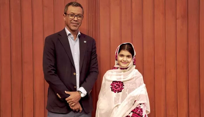 Unicefs newly-appointed Youth Advocate for Climate Action and Girls’ Empowerment Zunaira Qayyum poses for a picture with an official. — Unicef