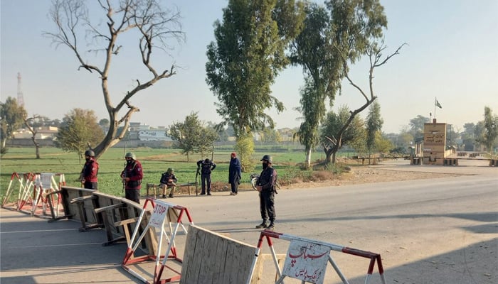 Pakistani soldiers stand guard on a road leading to the cantonment area in Bannu, Pakistan December 20, 2022. — Reuters