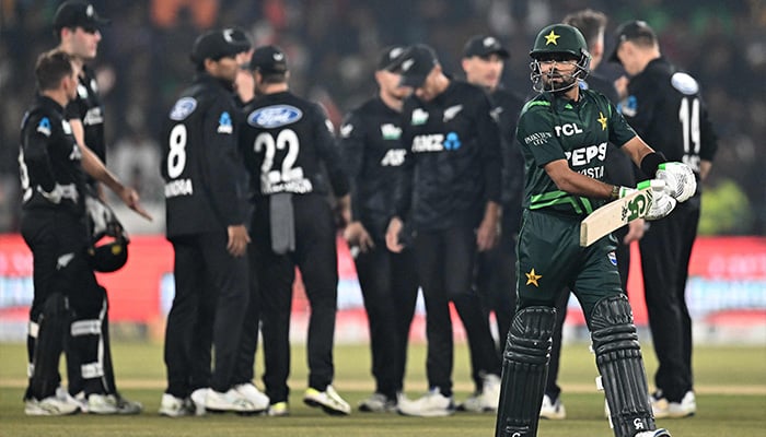 Pakistans Babar Azam walks back to the pavilion after his dismissal during the Tri-Nation series first one-day international cricket match between Pakistan and New Zealand at the Gaddafi Stadium in Lahore on February 8, 2025. — AFP