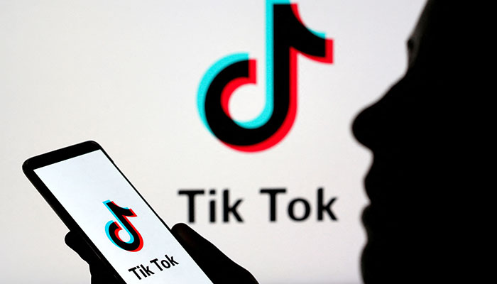 A person holds a smartphone with Tik Tok logo displayed in this picture illustration taken November 7, 2019. Picture taken November 7, 2019. — Reuters