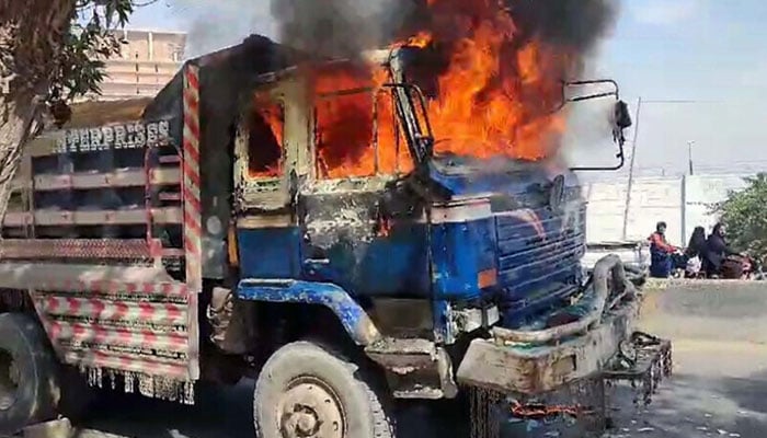 View of huge fire flames rise from burning vehicle after traffic accident, at Korangi area in Karachi on February 8, 2025. — PPI