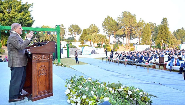 Prime Minister Shehbaz Sharif addresses a ceremony organised in connection with Youm-e-Tameer-o-Taraqqi. — APP/File