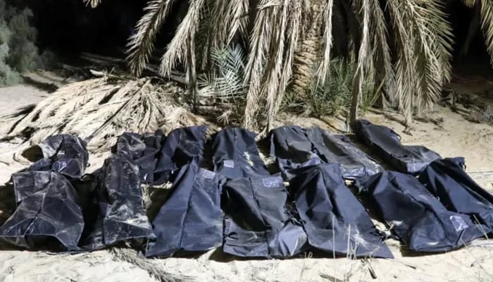 Bodies of migrants lie in bags, after they were discovered in a mass grave in a farm in Jikharra area, some 441 km from Benghazi, in Jikharra, Libya, February 5, 2025. — Reuters