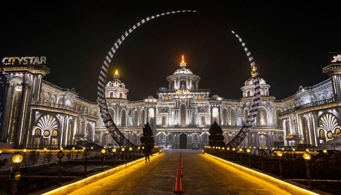 This picture taken on February 2, 2025 shows an illuminated wedding hall, at night in Kabul, Afghanistan. — AFP