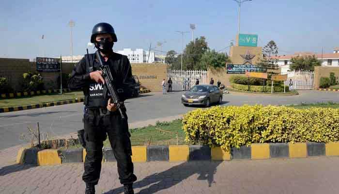 A security official on high alert at the National Stadium during the Pakistan Cricket team training and practice session in connection with upcoming test match between Pakistan and South Africa cricket teams. – APP/File