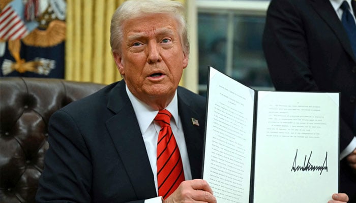 US President Donald Trump signs an executive order in the Oval Office of the White House on February 10, 2025, in Washington, DC.— AFP