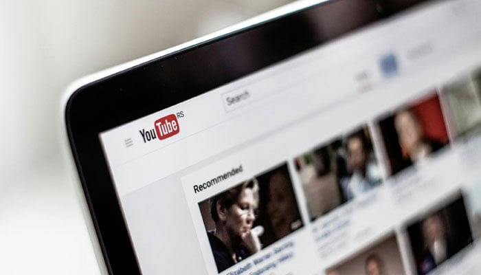 This representational image shows the YouTube website displayed on a computer. — Unsplash