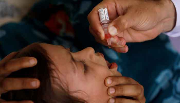 Polio vaccine drops are administered to a child at a civil dispensary in Peshawar, Pakistan, July 11, 2019. — Reuters