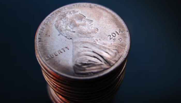 A pile of American coins to a one hundred representative Abraham Lincoln is shown in this photo illustration in Incinitas, California, United States, March 26, 2015. - Reuters