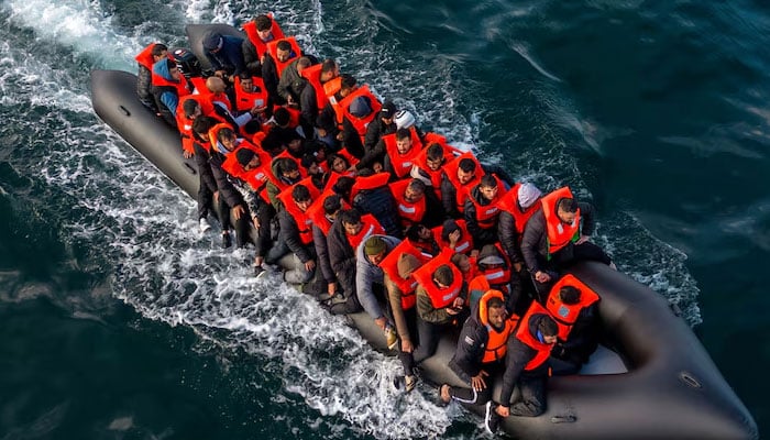 An undated image showing inflatable dinghy carrying migrants. — Reuters/File