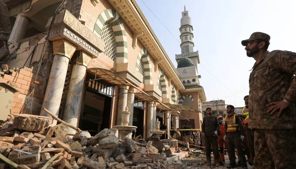 Soldiers and rescue workers survey the damage after a suicide blast in a mosque in Peshawar, Pakistan. — Reuters/File