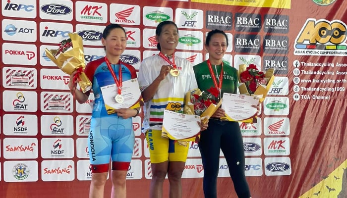 Pakistans Zainab Rizwan on the podium after winning gold in the 50+ age category during the Asian Road Cycling Championships in Thailand. — Reporter