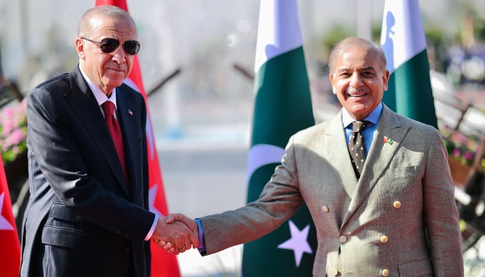 Turkish President Recep Tayyip Erdogan (left) shakes hands with Prime Minister Shehbaz Sharif at the PM House in Islamabad, on February 13, 2025. — PM Office