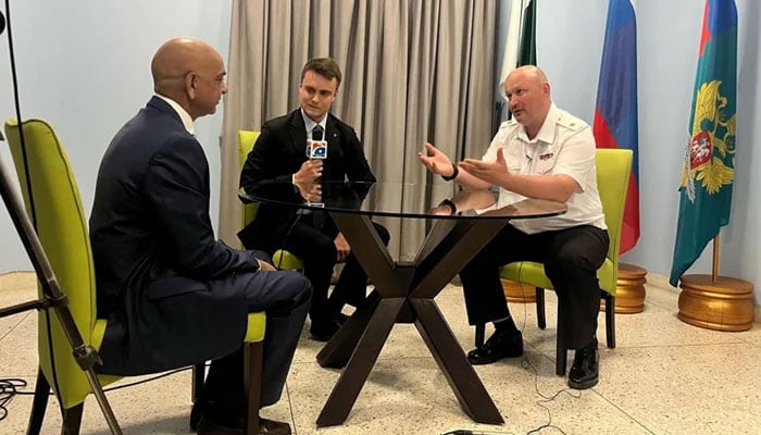 Russian Navy Commander Rear Admiral A Y Sisyoev (right) speaks during an interview in Karachi. — Reporter