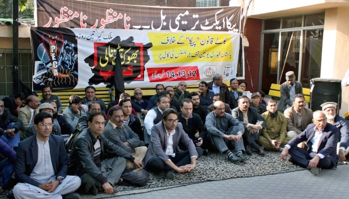 Members of PFUJ are holding protest demonstration against the recently passed amendments to the Peca law at Lahore Press Club on February 12, 2025. — PPI