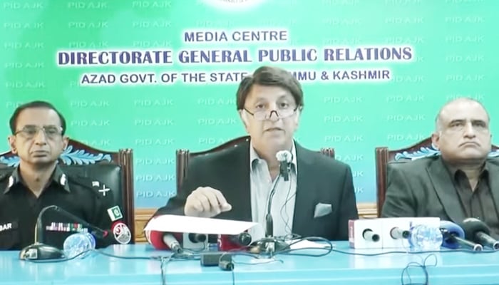 AJK Interior Minister Waqar Ahmad Noor addressing the media at the Directorate General Public Relations office in AJK on February 14, 2025. — Screengrab/Geo News/YouTube