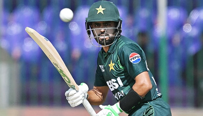 Babar Azam watches the ball after playing a shot during the Tri-Nation series final ODI match between Pakistan and New Zealand at the National Stadium in Karachi on February 14, 2025. — AFP