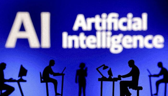 Figurines with computers and smartphones are seen in front of the words Artificial Intelligence AI in this illustration taken, February 19, 2024. — Reuters