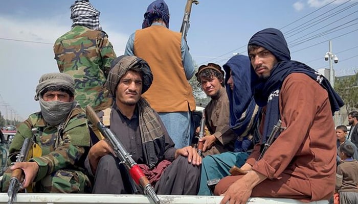 Taliban forces patrol near the entrance gate of Hamid Karzai International Airport in Kabul, Afghanistan August 31, 2021. — Reuters