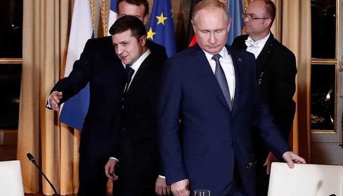 French President Emmanuel Macron, Russian President Vladimir Putin and Ukrainian President Volodymyr Zelenskiy arrive for a working session during a summit on the conflict in Ukraine at the Elysee Palace in Paris, France December 9, 2019. — Reuters