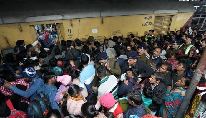 A large number of passengers are seen at a railway station in India. — PTI