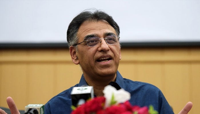 Former PTI leader and ex-minister Asad Umar speaks to the media during a press conference. — AFP/File