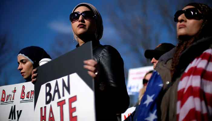 Activist groups hold a rally in front of the White House to mark the anniversary of the first Trump administration travel and refugee ban, January 27, 2018. — Reuters