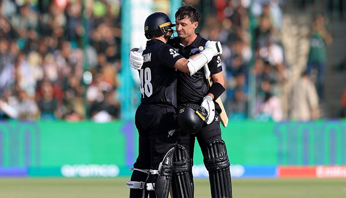 New Zealands Will Young celebrates after reaching his century along with Tom Latham during first match of the ICC Champions Trophy 2025 at National Bank Stadium, Karachi, on February 19, 2025. — Reuters