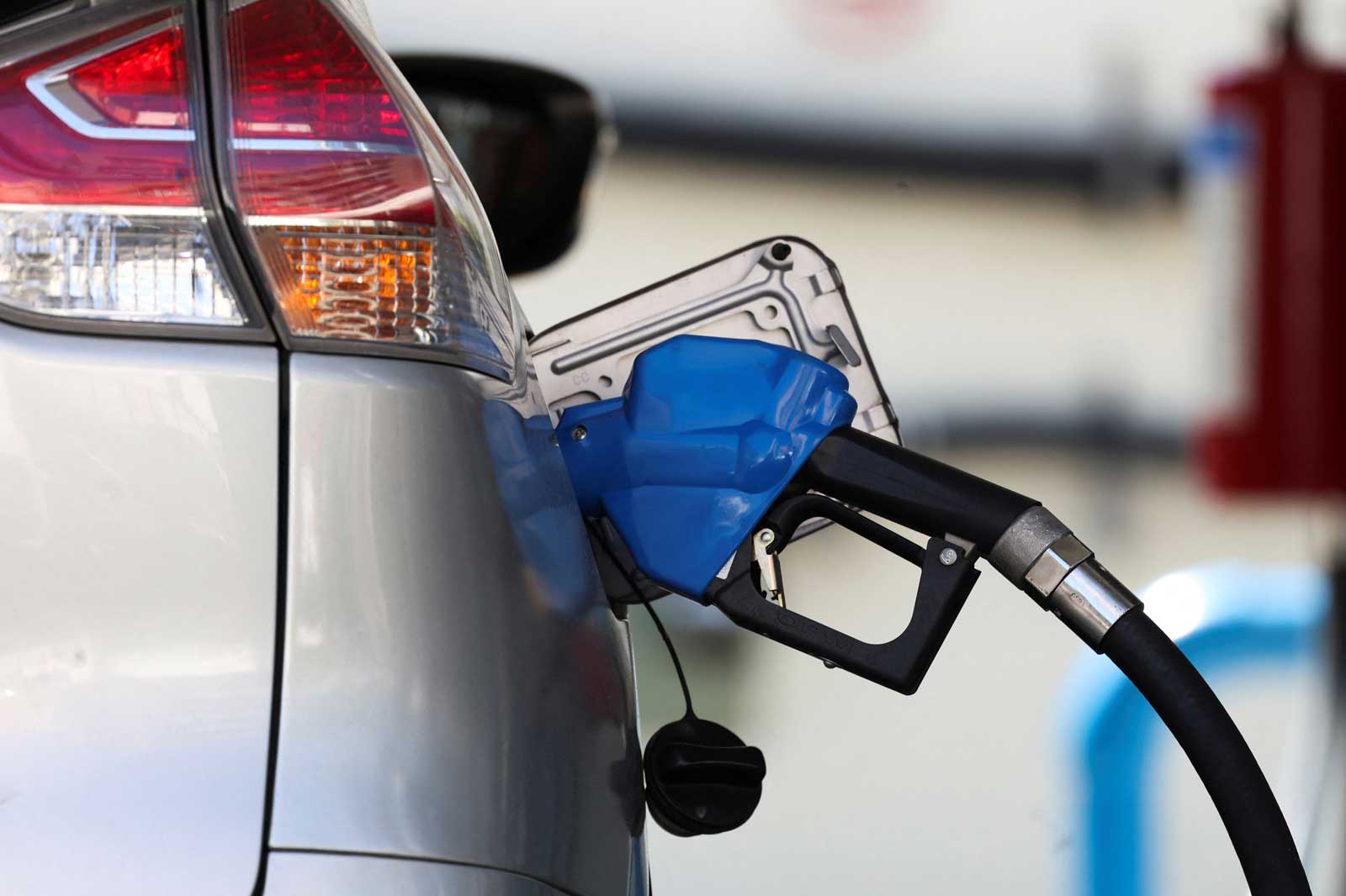 A fuel dispenser nozzle is pictured at a petrol station. — Reuters/File