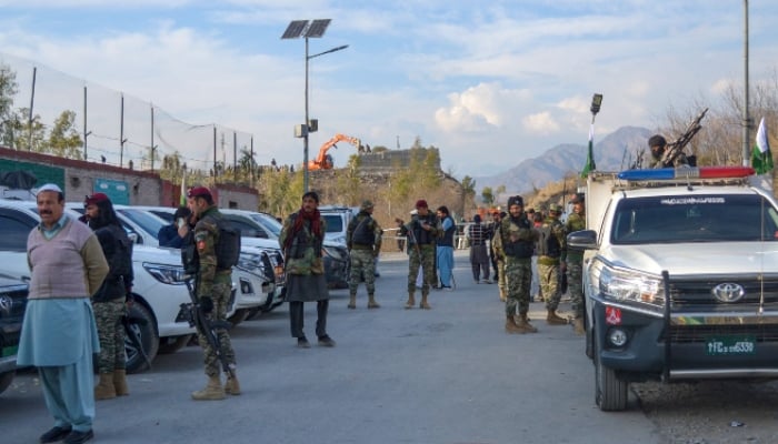 Frontier Constabulary and army personnel gather near the ambushed region in Kurram, on January 17, 2025. — AFP